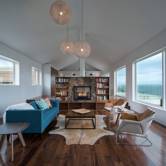 Jill Greaves Design in collaboration with Omar Gandhi Architect.  A multi-level, residential retreat complete with full-length cathedral ceiling, hardwood floors and panorama views.  A central hearth,