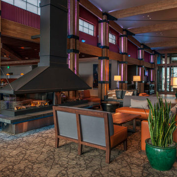 Two Lucius 140 fireplaces, by Element4, surrounded by leather couches stocked wi