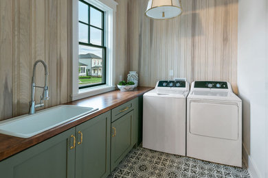 Inspiration for a mid-sized contemporary laundry room remodel in Other