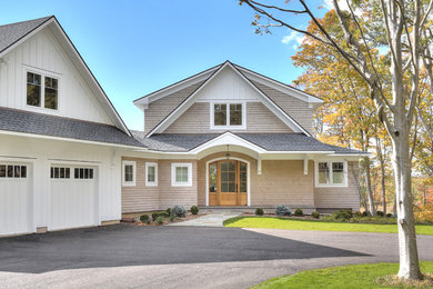 Example of a large beach style beige two-story concrete fiberboard gable roof design in Bridgeport