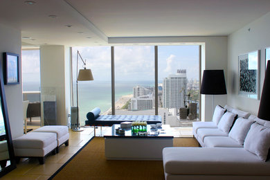 Large trendy formal and open concept beige floor living room photo in Miami with white walls, no fireplace and no tv