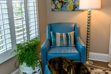 Example of a beach style dark wood floor bedroom design in DC Metro with beige walls