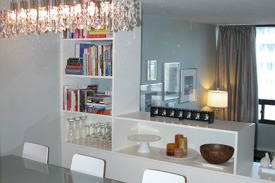 Photo of a small contemporary open plan dining in Edmonton with green walls.