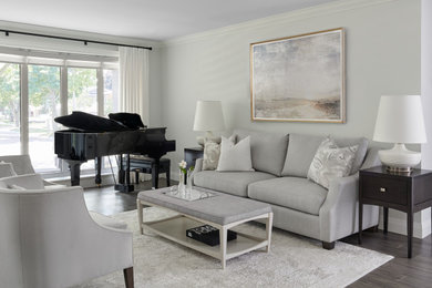 Photo of a small transitional open concept living room in Toronto with a music area, grey walls, medium hardwood floors, no fireplace and no tv.