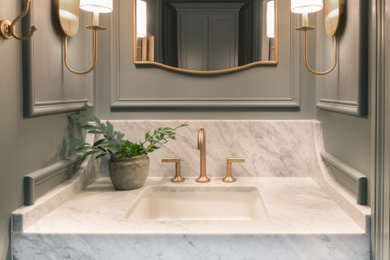 Example of a small transitional marble floor, white floor and wall paneling powder room design in Other with white cabinets, marble countertops and a floating vanity