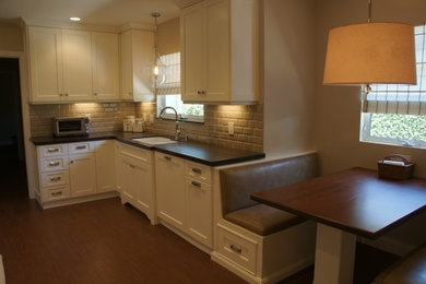 Example of a classic eat-in kitchen design in Los Angeles with no island