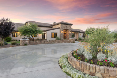 Example of a french country exterior home design in Los Angeles