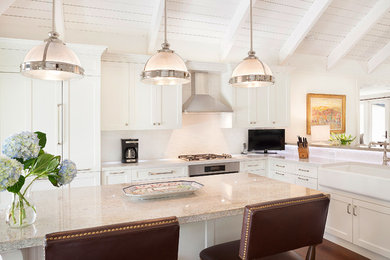 Example of a transitional dark wood floor kitchen design in Miami with an island and white backsplash
