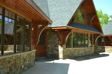 Example of a mountain style home design design in Minneapolis