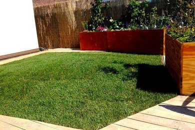 Inspiration for a huge modern front yard landscaping in New York with decking.