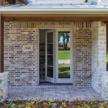 Inside swing single french door with large side lite to make it appear