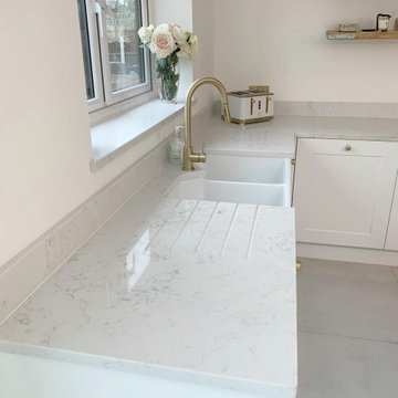 Traditional Kitchen with Navy Blue Island and White Natural Stone Effect Worktop