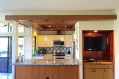 Mid-sized transitional u-shaped dark wood floor eat-in kitchen photo in Hawaii with a single-bowl sink, recessed-panel cabinets, white cabinets, granite countertops, multicolored backsplash, glass tile backsplash, stainless steel appliances and no island