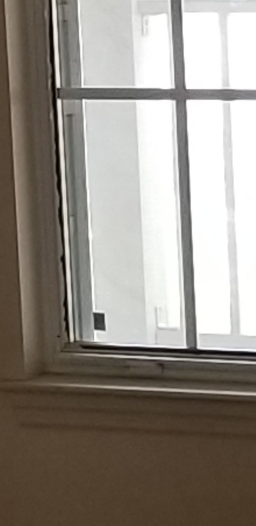 Crumbling glazing beads in aluminum single hung windows of a flip