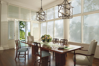 Example of a large beach style dark wood floor enclosed dining room design in Orange County with beige walls and no fireplace