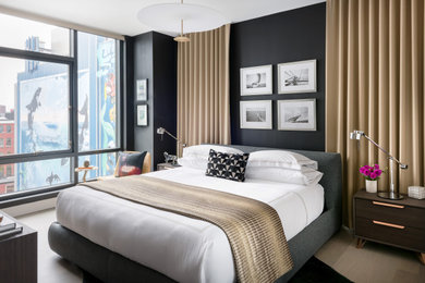 Example of a small trendy master light wood floor and beige floor bedroom design in Boston with black walls