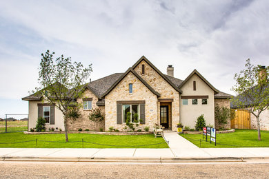 Large elegant brown one-story mixed siding exterior home photo in Austin with a shingle roof