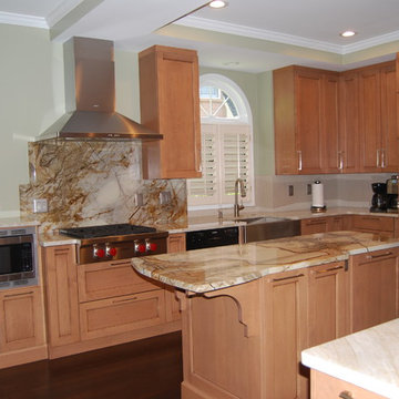 MEDIUM STAIN CABINETRY WITH ROMA IMPERIALE QUARTZITE