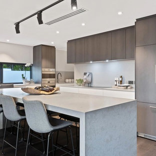 Inspiration for a contemporary kitchen in Perth with flat-panel cabinets, brown cabinets, grey splashback, panelled appliances, dark hardwood floors, with island, brown floor and grey benchtop.