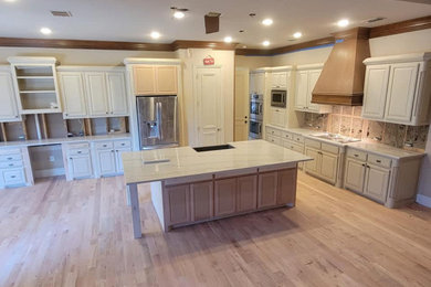 Large elegant kitchen pantry photo in Dallas with an undermount sink and stone tile backsplash