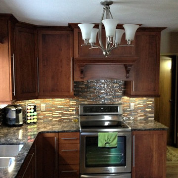 Omega Cabinetry. Plainfield door, Cherry wood, Nutmeg stain