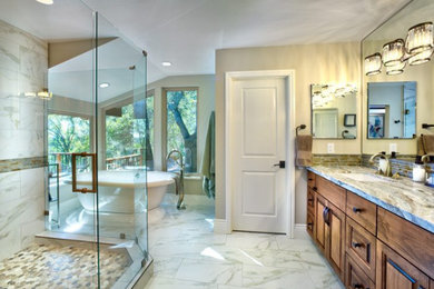 Bathroom - large traditional master beige tile, brown tile, gray tile and matchstick tile marble floor, white floor and double-sink bathroom idea in Other with a hinged shower door, gray countertops, raised-panel cabinets, medium tone wood cabinets, beige walls, an undermount sink, granite countertops and a built-in vanity