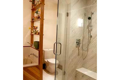 Inspiration for a mid-sized modern master white tile and porcelain tile porcelain tile bathroom remodel with flat-panel cabinets, medium tone wood cabinets, a two-piece toilet, white walls, an undermount sink and wood countertops