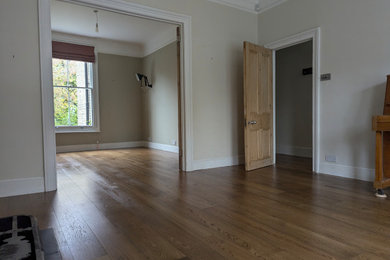 Photo of a large victorian enclosed living room in London with medium hardwood flooring.
