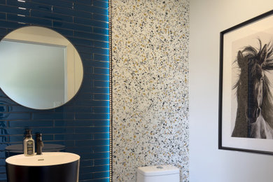 Inspiration for a small modern blue tile and glass tile terrazzo floor and multicolored floor powder room remodel in Toronto with a pedestal sink