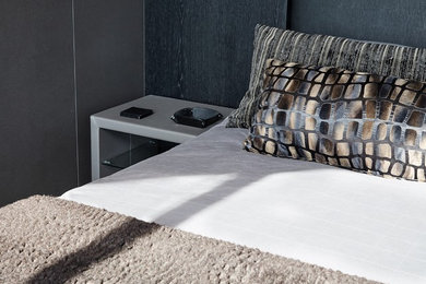 Bedroom - contemporary master carpeted bedroom idea in London with gray walls