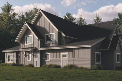 Example of a large arts and crafts beige two-story mixed siding and board and batten exterior home design in Portland with a shingle roof and a black roof