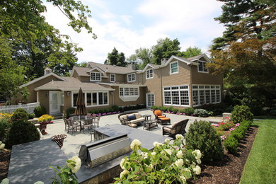 Large elegant brown two-story wood gable roof photo in New York