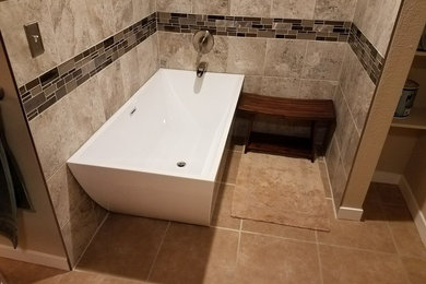 Mid-sized elegant master gray tile and ceramic tile ceramic tile and beige floor bathroom photo in Seattle with beige walls and a hinged shower door