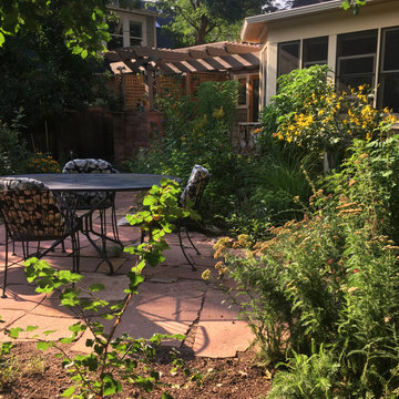 Rustic and Playful Stone Patio In Tranquil Garden
