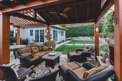 Sunroom - small concrete floor and gray floor sunroom idea in Santa Barbara with a standard fireplace, a stone fireplace and a standard ceiling