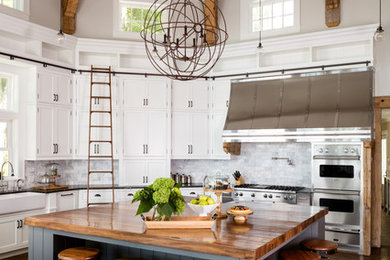 Kitchen - country dark wood floor kitchen idea in Chicago with shaker cabinets, white cabinets, gray backsplash, stainless steel appliances and an island