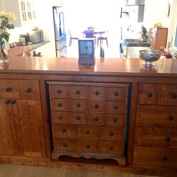 Tiger maple peninsula stained to match and antique apothocary