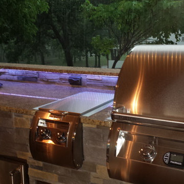 L Shaped Outdoor Kitchen With Unique Lighting