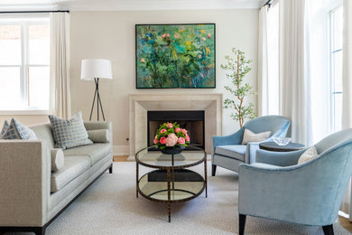 Example of a mid-sized transitional open concept light wood floor and brown floor living room design in Chicago with white walls, a standard fireplace, a stone fireplace and no tv