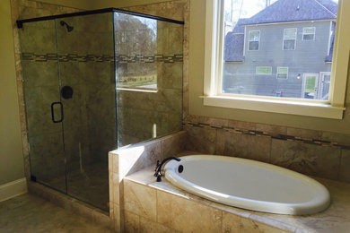 Example of a mid-sized classic master beige tile and porcelain tile porcelain tile and beige floor bathroom design in Atlanta with beige walls and a hinged shower door