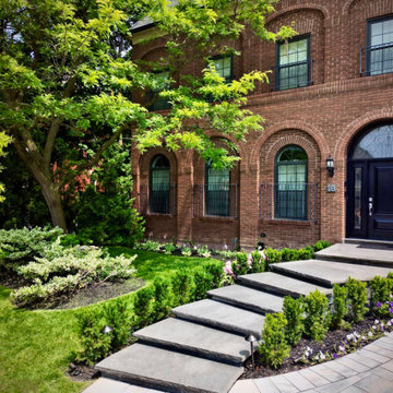 Custom Curved Granite Front Steps Framed by Existing Landscaping