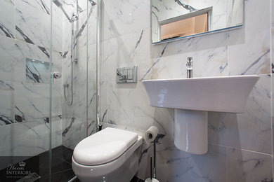 This is an example of a bohemian ensuite bathroom in Other with black and white tiles, a built-in sink and white walls.