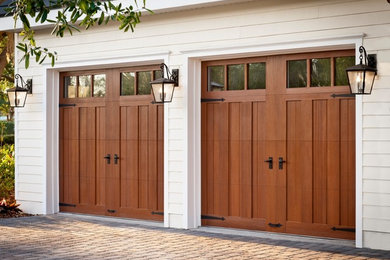Photo of a mid-sized traditional attached two-car garage in Los Angeles.