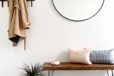 Example of a transitional entryway design in DC Metro with white walls