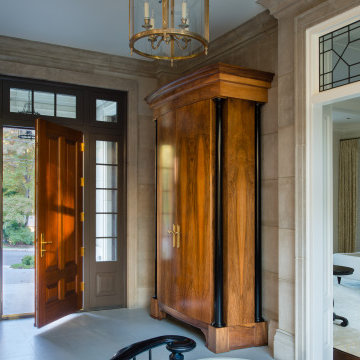Limestone Entry Foyer and Mahogany Armoire closets
