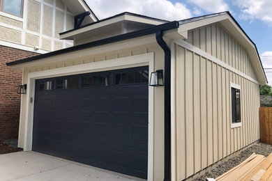 Garage - large craftsman detached two-car garage idea in Denver