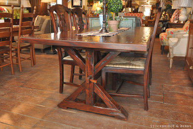 Great room - mid-sized traditional medium tone wood floor great room idea in New York with white walls and no fireplace