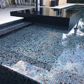 Contemporary pool with two tone recycled glass mosaic mixes