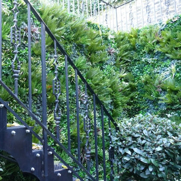 Unsightly Staircase gets Upgraded with Fake Green Walls
