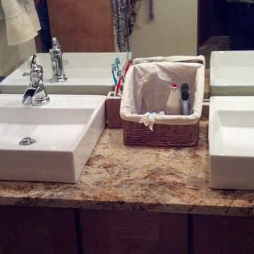 Diamond Cabinetry w/Colonial Gold Granite and Travertine Tub Surround